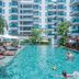 Fishermen's Harbour Urban Resort in Patong with a large outdoor pool and sun loungers