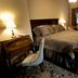 The Thornton Inn Bed and Breakfast in Arlington guest room with king bed, desk, and warm lighting