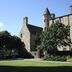 Siberia Bar & Hotel in Aberdeen, stone castle-style hotel exterior with turret and lawn