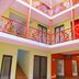 Patio Antigo Residence in Santa Maria, colorful courtyard with orange balconies and open atrium