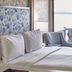 The Beach Haus - Traverse City room with king bed and balcony view of the water