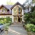 Hotel am Katharinenholz in Potsdam, exterior with pitched roof, garden entrance and parked cars