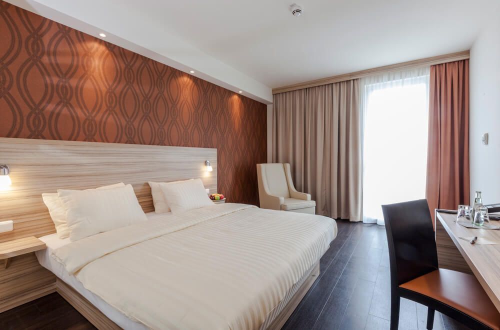 Star G Hotel Premium München Domagkstraße room with king bed, desk and chair, and floor-to-ceiling window in Munich