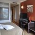 Hotel Palau de Girona room in Sarrià de Ter with TV desk, wall sconces and window view