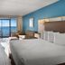 Captain's Quarters Resort in Myrtle Beach room with ocean-view balcony, king bed and sofa