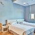 Provista Hotel Gangnam room in Seoul with two twin beds, bedside table, desk, and window with blinds