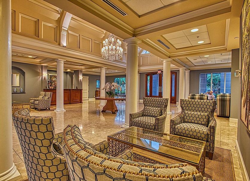 Trianon Bonita Bay Hotel in Bonita Springs lobby with chandelier, columns and seating area