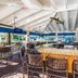 Trianon Bonita Bay Hotel in Bonita Springs bar with granite counter, high stools and TV displays