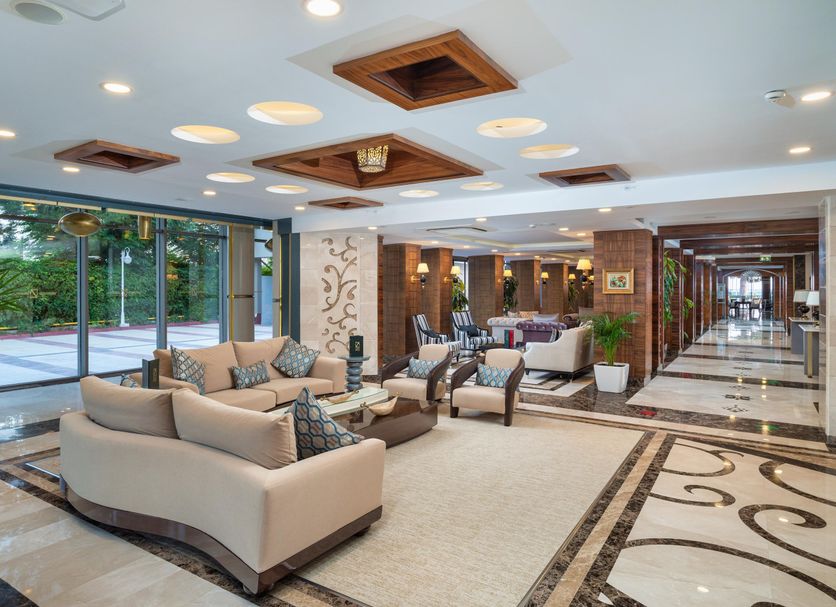 Delta Hotels by Marriott Antalya Lara Adult Only(+18) lobby lounge with seating, marble floors and glass walls in Antalya