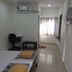 Vrp Guest House in Bhuj room with twin bed, desk, air conditioner and window seating area