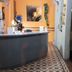 Hotel avenida in La Plata reception desk with patterned tile floor and orange walls