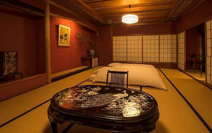 Yamanoo in Kanazawa: traditional tatami room with low table, floor cushions, and shoji screens