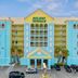 Holiday Terrace Beachfront Hotel in Panama City Beach with turquoise exterior and ocean view