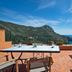 Boutique Hotel Torre Di Cala Piccola terrace with table, chairs and sea view in Monte Argentario