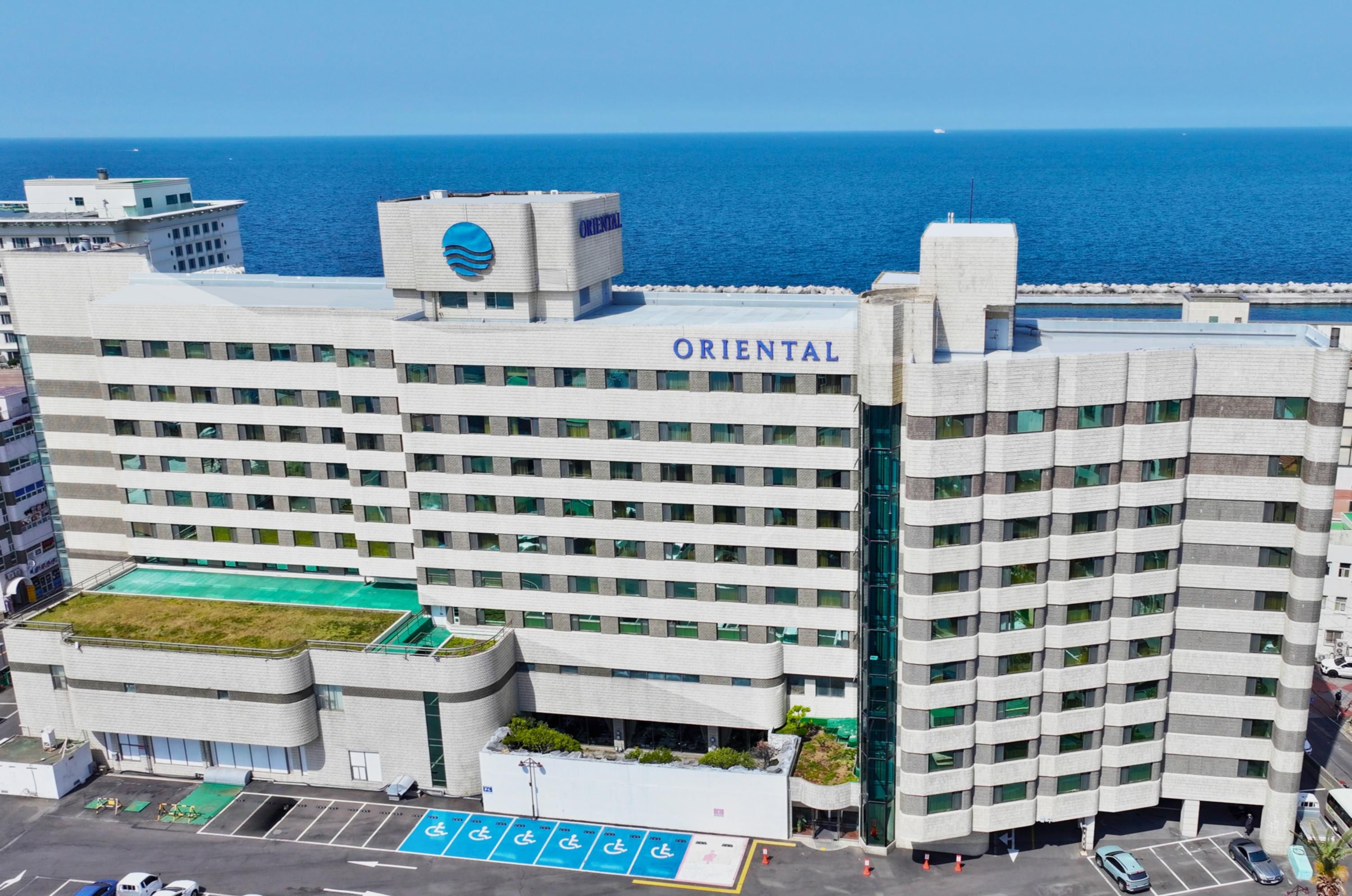 Jeju Oriental Hotel & Casino in Jeju City with oceanfront views and exterior facade