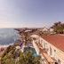 Hotel Masa International in Torrevieja with ocean-view pool and coastal cliffside scenery