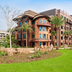 Disney Explorers Lodge in Hong Kong with landscaped garden and palm trees outside the hotel