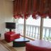 Hotel Liro - Adults Only in Vlorë room with sea-view windows, balcony railing, red ottomans and TV