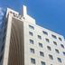 Akashi Luminous Hotel in Akashi, white mid-rise hotel against a blue sky