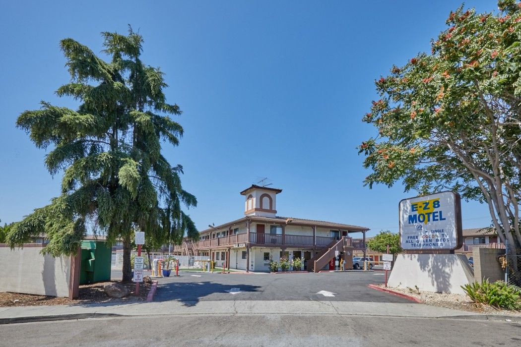 Ez 8 Motel Newark exterior with sign, two-story building, and clear blue sky