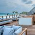 Heritance Aarah in Meedhoo with overwater deck seating and a thatched-roof pavilion above the sea