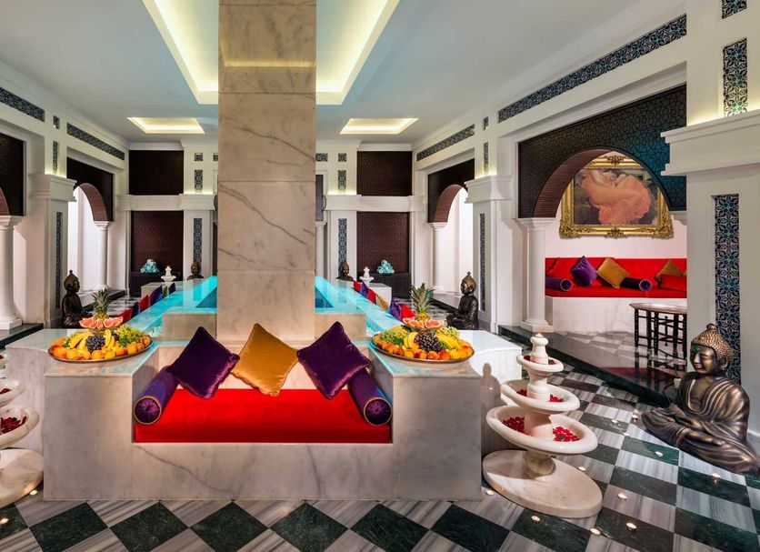 Vogue Hotel Supreme Bodrum in Torba lobby with ornate seating, marble floors, and colorful decor