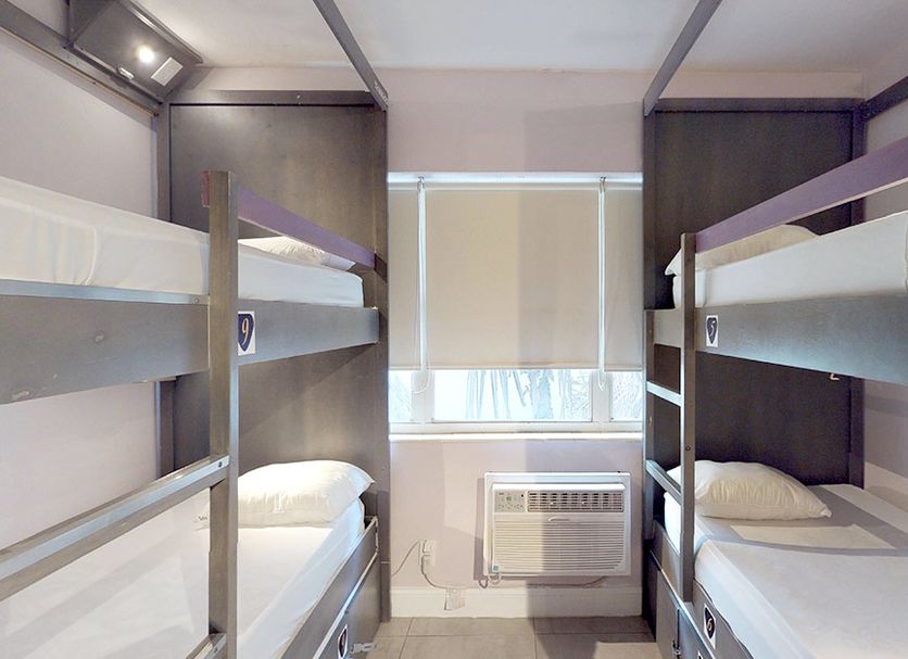 Rock Apartments by Lowkl in Miami Beach, bunk bed guest room with window air conditioner
