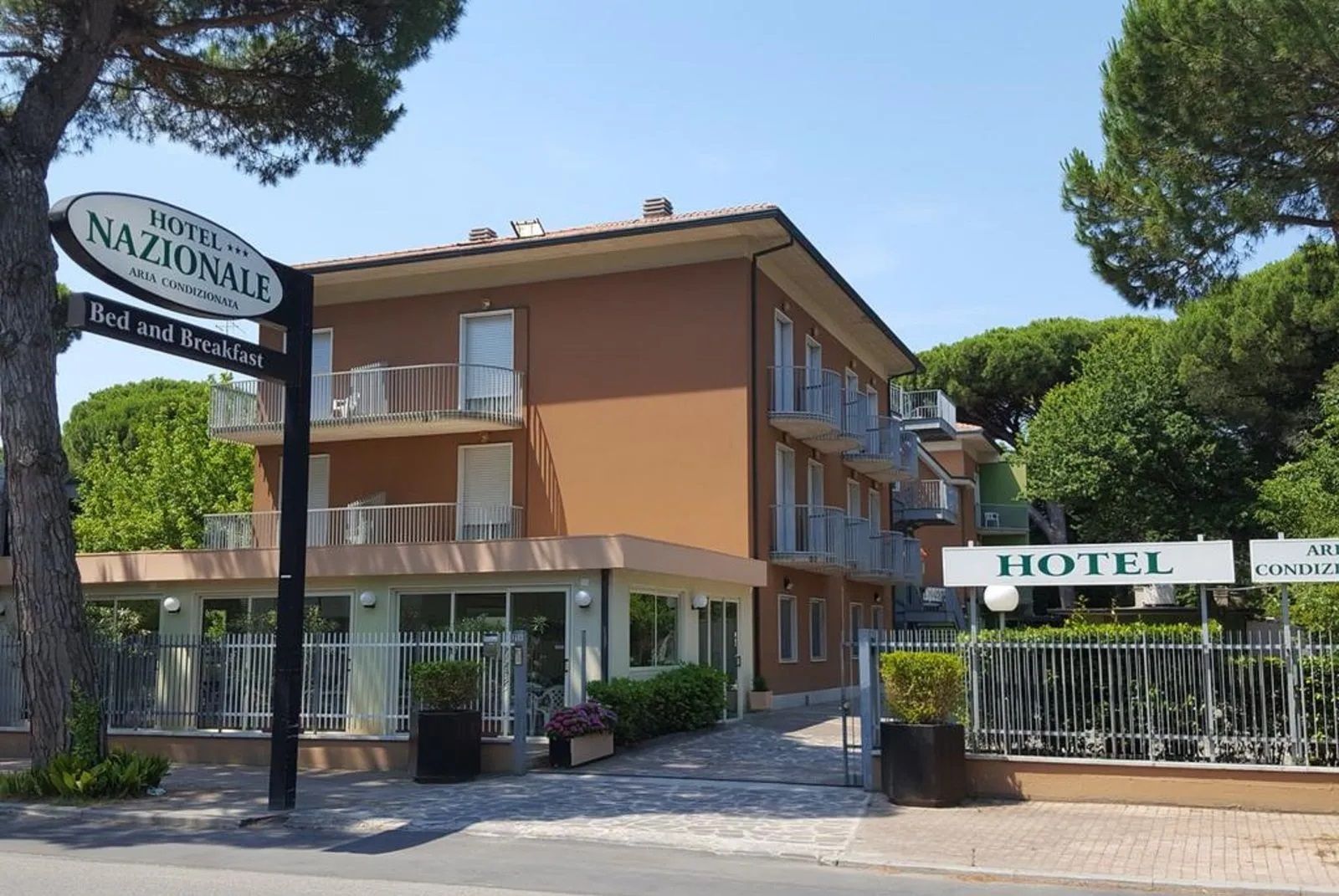 Hotel Nazionale in Milano Marittima exterior with balconies and entrance gate