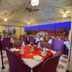 Umaid Mahal Jaipur rooftop dining area with candlelit tables and city views at dusk