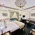 Umaid Mahal in Jaipur: heritage-style room with ornate ceiling, king bed, seating nook and desk