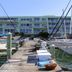 Chart House Suites and Marina in Clearwater Beach with a marina dock, sailboats, and waterfront hotel view