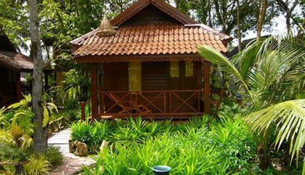 Lantawadee Resort And Spa in Ko Lanta, tropical bungalow surrounded by lush greenery
