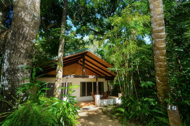Kewarra Beach Resort & Spa in Cairns, tropical bungalow surrounded by lush rainforest