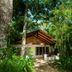 Kewarra Beach Resort & Spa in Cairns, tropical bungalow surrounded by lush rainforest