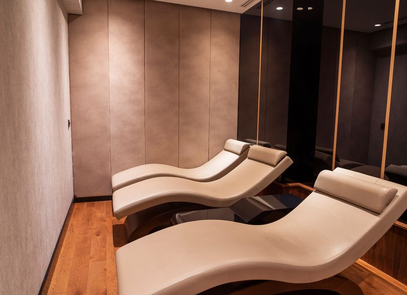 Ramada Plaza by Wyndham Istanbul City Center spa lounge with two beige chaise lounge chairs in Istanbul