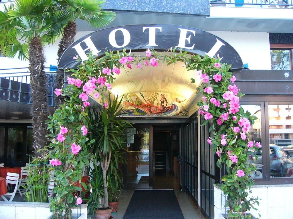 Hotel Serena in Grado entrance with floral arch and arched HOTEL sign