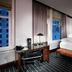 Staypineapple, An Iconic Hotel, The Loop Chicago guest room with king bed, desk and city-view windows