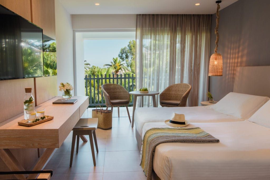 Nissi Beach Resort in Ayia Napa room with balcony view, twin beds, and seating area