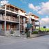 Domus Inn in Ioánnina, three-story hotel with balconies and mountain-view setting