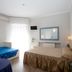 Hotel Il Gatto in Rapallo guest room with bed, single bed, wall mirror and bright window