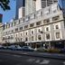 Great Southern Hotel Melbourne exterior on a city street in Melbourne with tall buildings behind