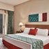 Fanadir Hotel El Gouna guest room with king bed, balcony doors and pool view in El Gouna