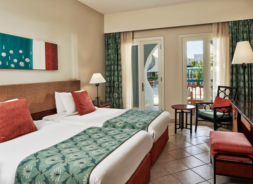 Fanadir Hotel El Gouna guest room with twin beds, balcony doors, and seating area