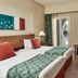 Fanadir Hotel El Gouna guest room with twin beds, balcony doors, and seating area